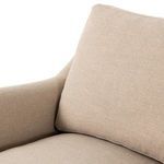 Close-up of beige Lynne Chair seat cushion and back pillow with slight pleats and soft texture