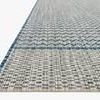 Isle Indoor Outdoor Rug with woven grey and blue geometric pattern and blue border edge