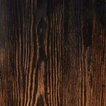 angled close-up of door edges with visible metal knobs and accented wood grain finish