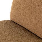 Close-up of Bronwyn chair seat and back corner seam with textured amber upholstery