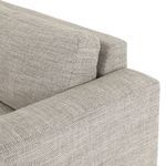 Close-up of back cushions and arm corner seam showing fabric stitching detail