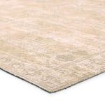 Close-up angle showing flat weave texture and distressed geometric detail in tan and cream tones
