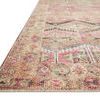 Close-up side angle showing low pile texture and intricate vintage pattern colors on the rug border