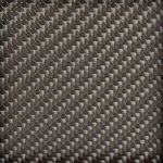 Close-up of dark brown woven rattan texture on the ottoman base