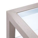 Close-up of top corner highlighting taupe gray oak wood grain and inset glass top