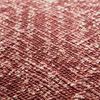 close-up showing woven texture and detailed pattern of red pillow fabric