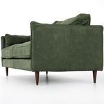 Full front view of sofa with almond tapered legs on white floor backdrop