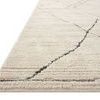 Close-up side view showing low pile height and clean edge of the Fabian Ivory / Charcoal Rug