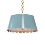 Blue Mirasol Pendant with scalloped edges and gold interior, hanging from a gold chain