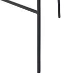 Close-up of matte black metal leg with round foot pad at bottom