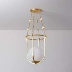 Side view of Verbank pendant showing cloud glass orb's subtle texture within gold cage