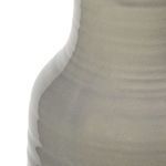 Close-up on subtle crackle texture and transparent variegated glaze of ceramic baluster base