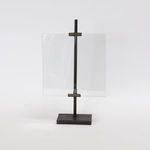 Kiran Gunmetal Picture Frame with a sleek gunmetal vertical stand and clear glass pane on a rectangular base