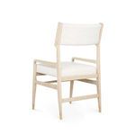 Angled rear view showing chair's tapered legs and supporting crossbars.
