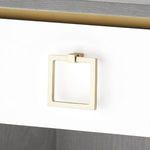Close-up of gold square-shaped drawer pull variant on white drawer front