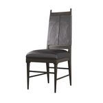 Three-quarter view of chair showcasing its slim silhouette and high back with cross-stitched leather