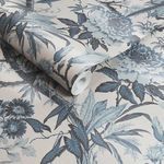 Close-up of rolled Perrow Wallpaper showing textured paper and detailed blue floral design