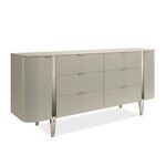 Love At First Sight dresser shown from angled front view highlighting curved ends and metallic vertical detailing on legs