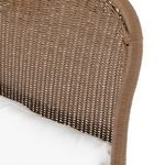 Tight view of curved woven fawn backrest showing detailed weaving pattern