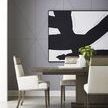 Chair styled in a modern dining room with a dark wooden table, gray paneled walls, and an abstract black and white wall art