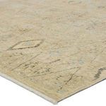 Close-up angled view showing the short fringe and fine geometric details on the rug’s zero-pile surface
