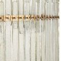 Close side angle showing the narrow vertical glass bars attached to the antique brass horizontal rings