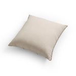 Side angled view of Calvin Outdoor Pillow highlighting its thickness and cushion fullness