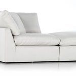 Close-up showing thick seat cushion and angled armrest detail on sectional sofa