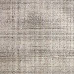 Close-up of rug surface texture showing fine horizontal and vertical thread details in subtle color shifts