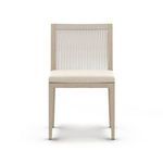 Front close-up emphasizing textured beige seat cushion and teak frame grain