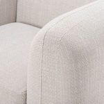 Close-up showing seam stitching along top edge of curved armrest
