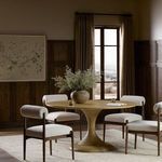 Dining room setting with Eastman table surrounded by four beige upholstered chairs.