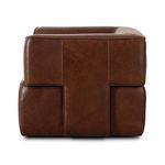 Direct side view highlighting leather panel seams and T-frame structure
