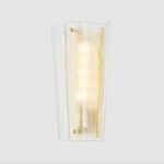Baxford Sconce mounted on a wall showing the warm light glow and translucent glass edges