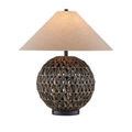 Casimer Black Table Lamp lit on wood furniture surface with stacked books