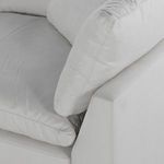 Extreme close-up of cushion corner seam and soft fabric texture on sectional sofa