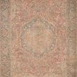 Full top-down view of Priya Brick Navy rug displaying overall medallion and border design in muted brick and navy tones