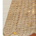 Close-up of natural seagrass weave and scalloped edge on tapered chandelier shade