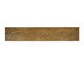 Straight-on view of the lower brass shelf emphasizing the worn, textured surface