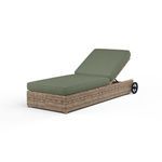 Outdoor chaise lounge with adjustable backrest, weathered tobacco wicker frame, and olive green cushions