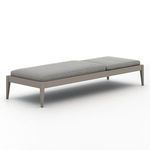 Outdoor chaise rear view with angled backrest, showcasing metal hinge and woven black support