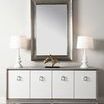 Styled room shot of Cameron 4-Door Cabinet with mirror, lamps, and decor on top
