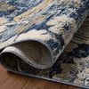 Close-up of the rug’s folded corner highlighting the woven texture and edge binding