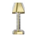 Lamp viewed from a slight angle showing the seamless slide-over brass shade on the stem