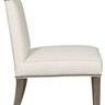 Side profile highlighting high backrest with distinct upholstery band and sculpted wood legs