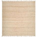 Square jute rug blending natural tones with fringed edges and visible woven pattern