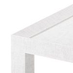 Close-up showing textured white lacquer finish and edge detail of Isadora Tea Table top