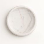 Overhead view showing circular shape and fine marble veining pattern on tray surface