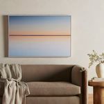 Horizon print displayed wall-mounted above a neutral-toned sofa and wooden side table