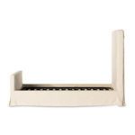 Full length shot of queen bed frame without mattress showing wooden slats on base